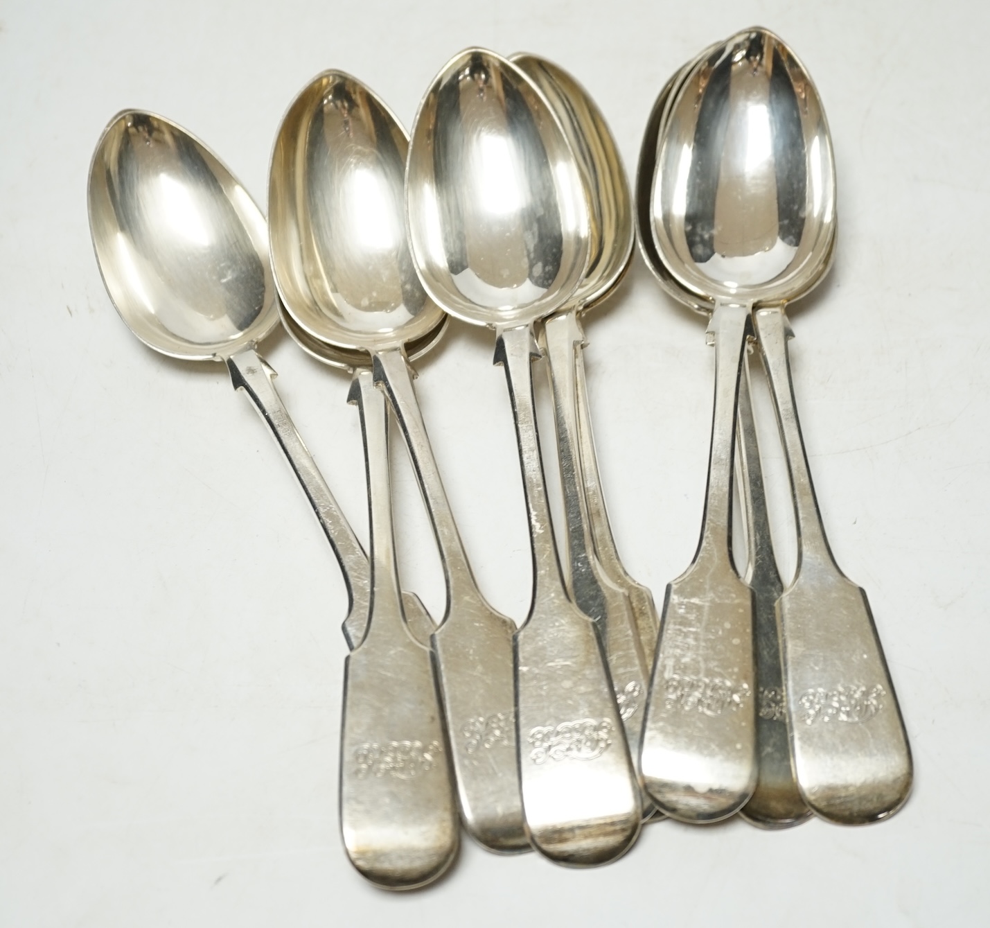 A set of twelve Victorian provincial silver fiddle pattern tablespoons, by Robert Williams & Sons, Exeter, 1852, 22.8cm, 30.4oz. Condition - fair